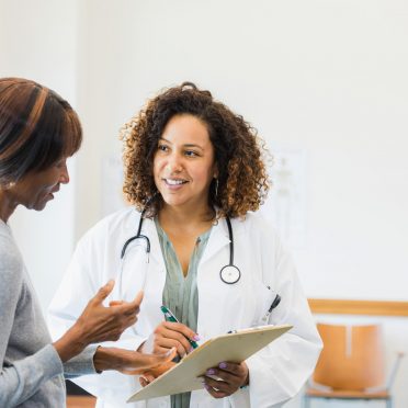 Doctor listens attentively as patient asks about rest results